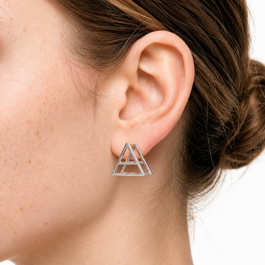 Model wearing the 3D Triad Earrings by Thirty Seconds To MARS