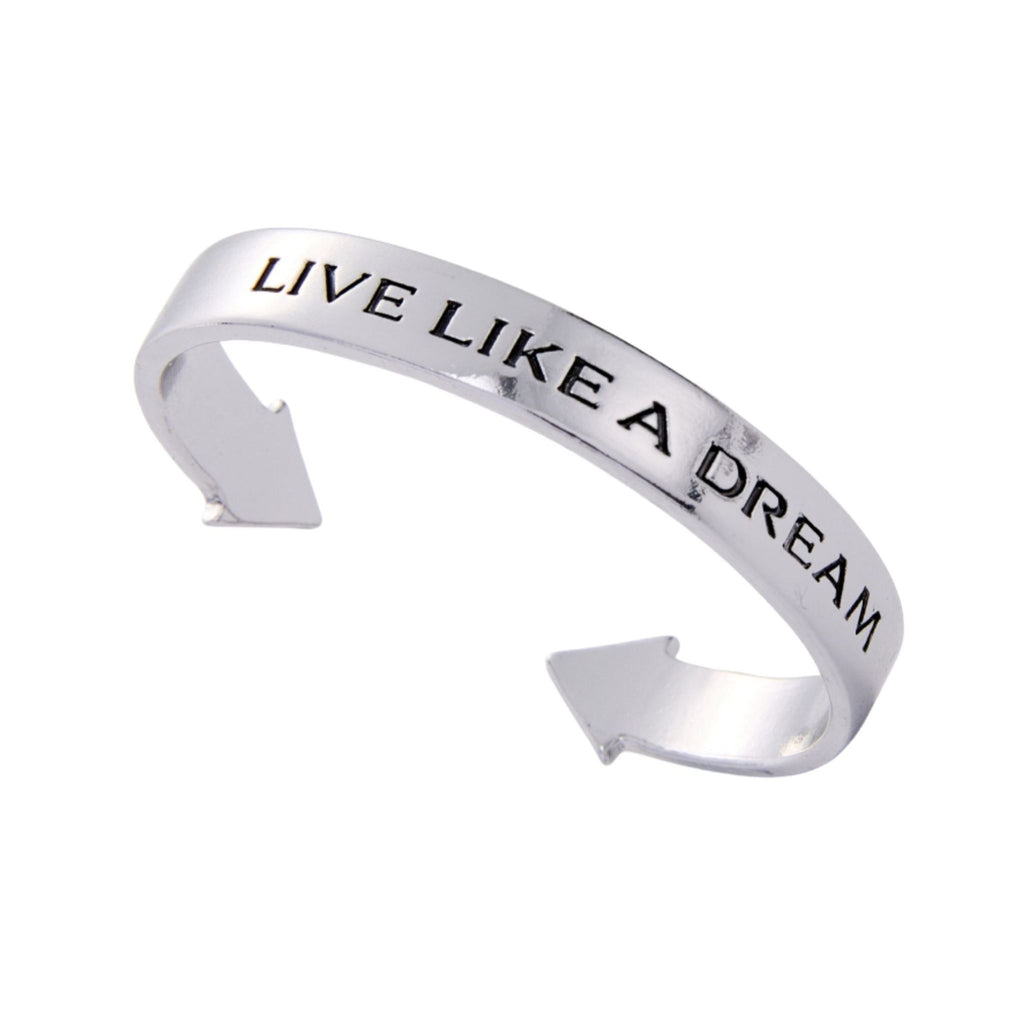 Silver bracelet with 'Live Like a Dream' engraving on a white background
