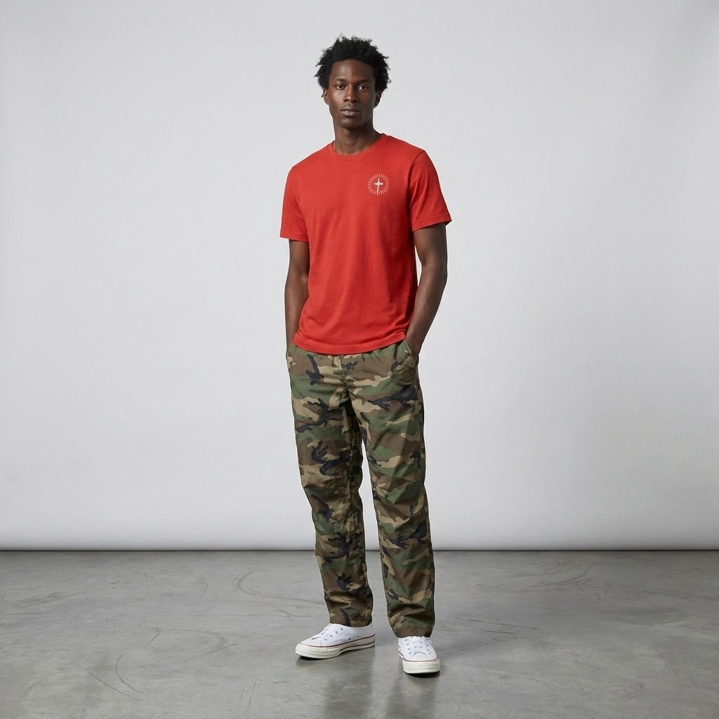 A male model on a clean background wearing the Circular Triad Tee in Red by Thirty Seconds To Mars