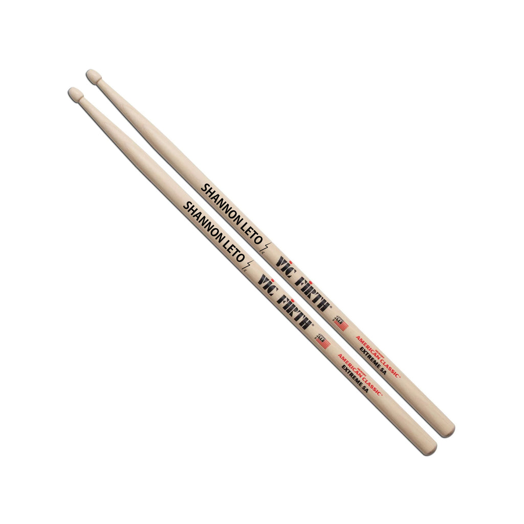 Two drumsticks with 'Shannon Leto' and Vic Firth branding on a white background
