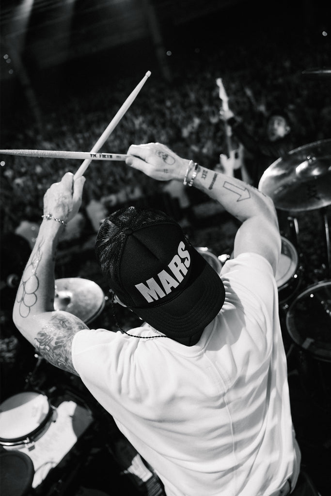 Shannon Leto in the MARS Trucker Hat drumming on stage